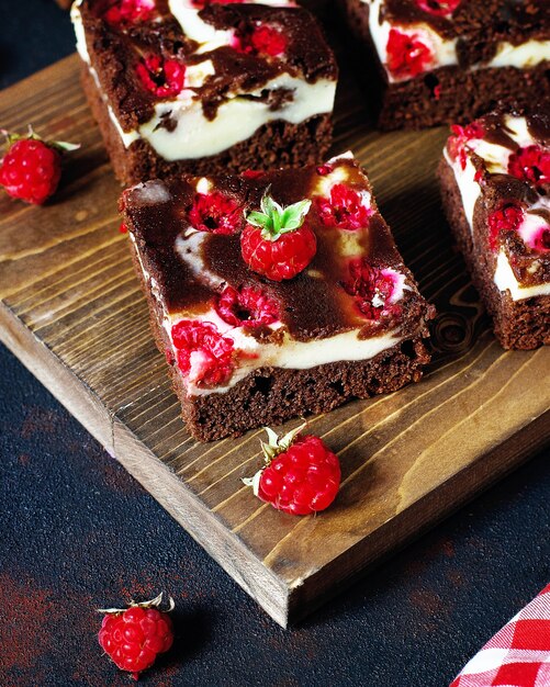 Brownies tower with cottage cheesecake and raspberries