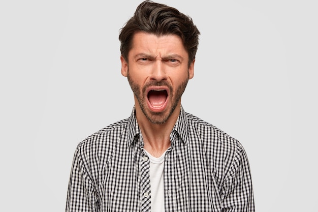 Brunet man wearing checkered shirt