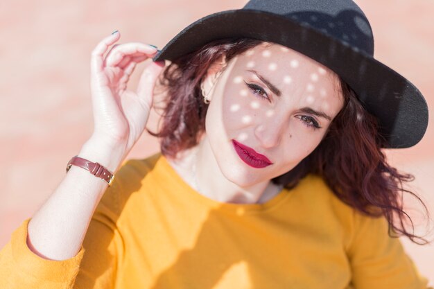 Brunette blogger posing for a photo