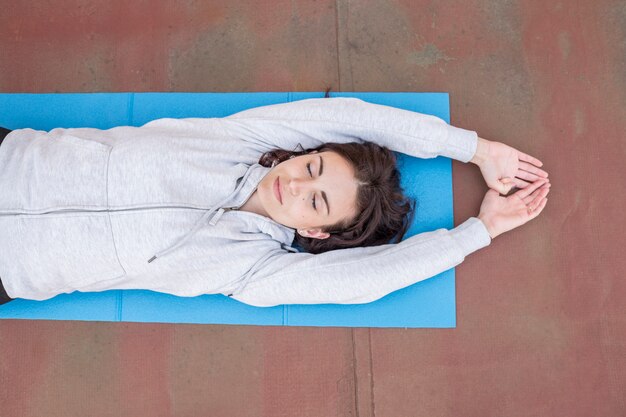 Brunette blogger recording yoga routine