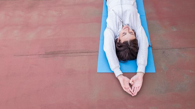 Brunette blogger recording yoga routine