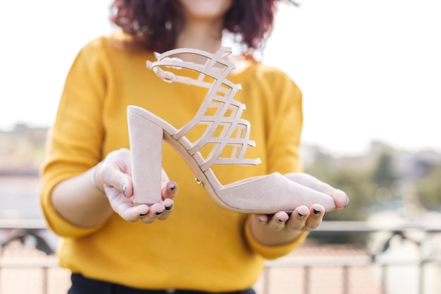 Free photo brunette blogger showing heel to the camera