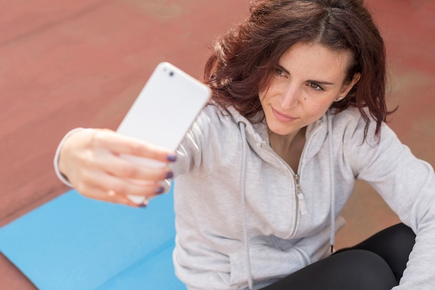 Brunette blogger taking a selfie