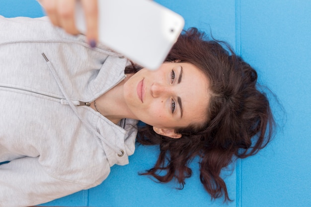 Brunette blogger taking a selfie