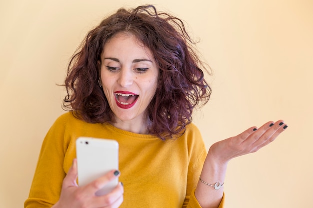 Brunette blogger using mobile phone