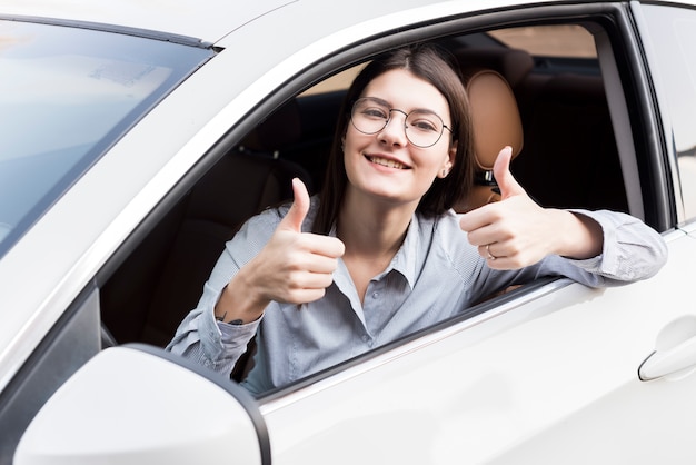 Brunette businesswoman inside a car