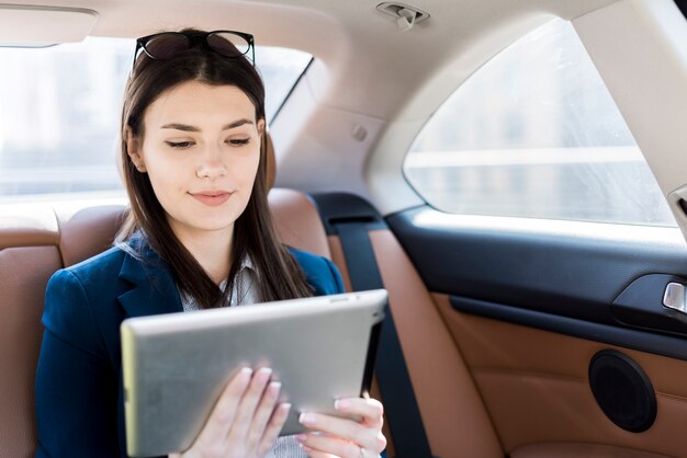 Brunette businesswoman inside a car