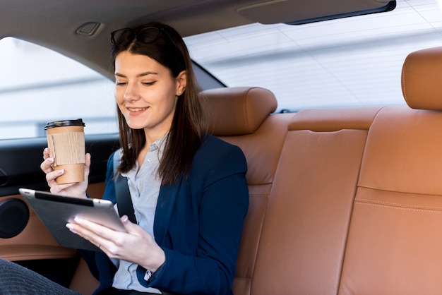 Brunette businesswoman inside a car