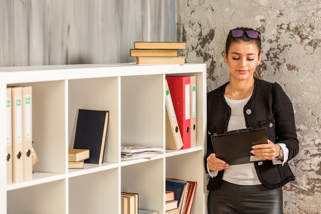 Brunette businesswoman using her tablet