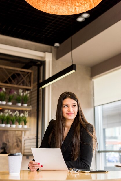 brunette businesswoman with document
