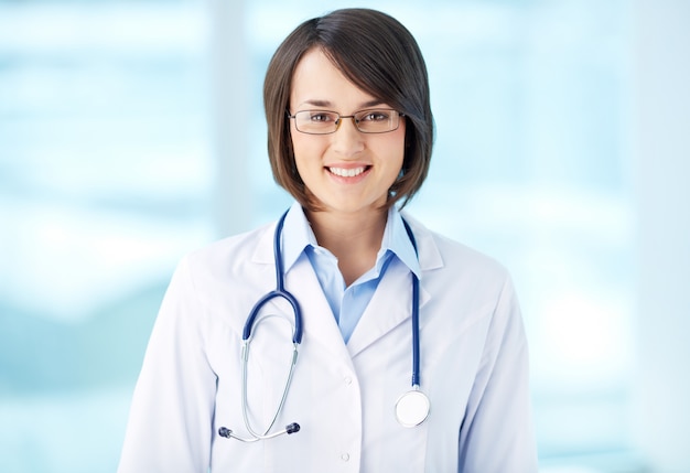Brunette doctor with glasses and stethoscope