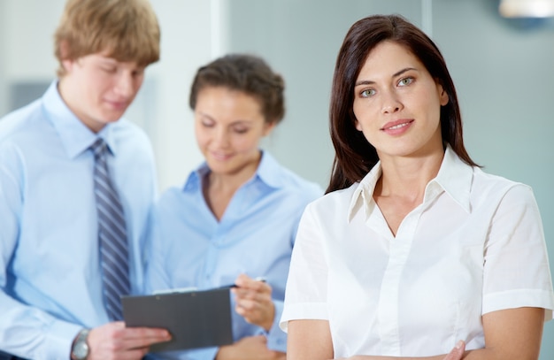 Brunette entrepreneur with employees background