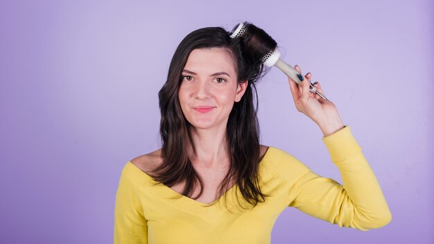 Brunette girl posing with brush