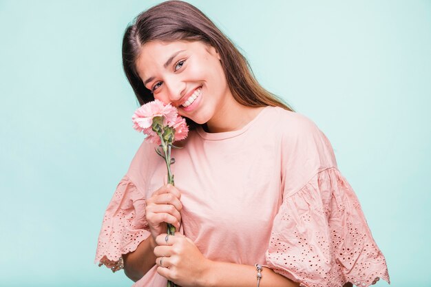 Brunette girl posing with flowers