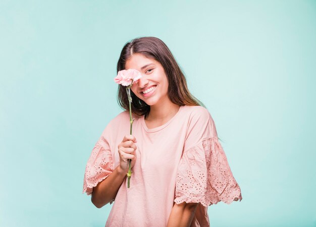 Brunette girl posing with flowers