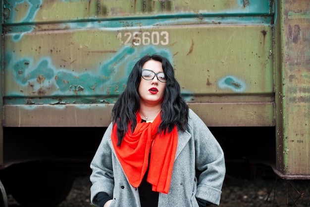 Free photo brunette girl wear in black with glasses in railway station