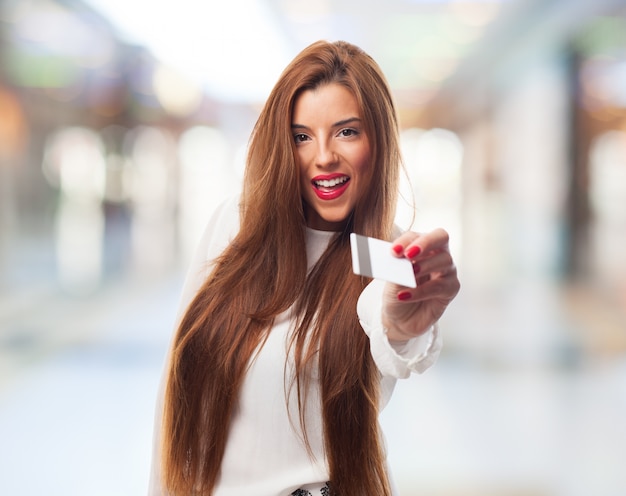 Brunette giving credit card.