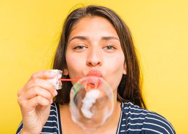 Brunette model blowing bubbles