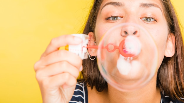 Brunette model blowing bubbles