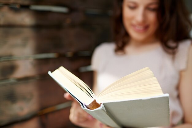 Brunette woman holding a book