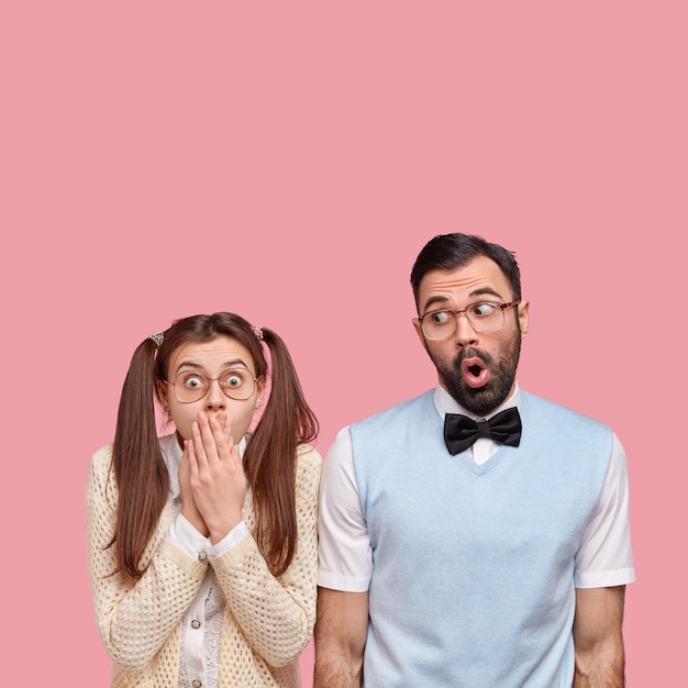 Free photo brunette woman with pigtails and man wearing bowtie and vest