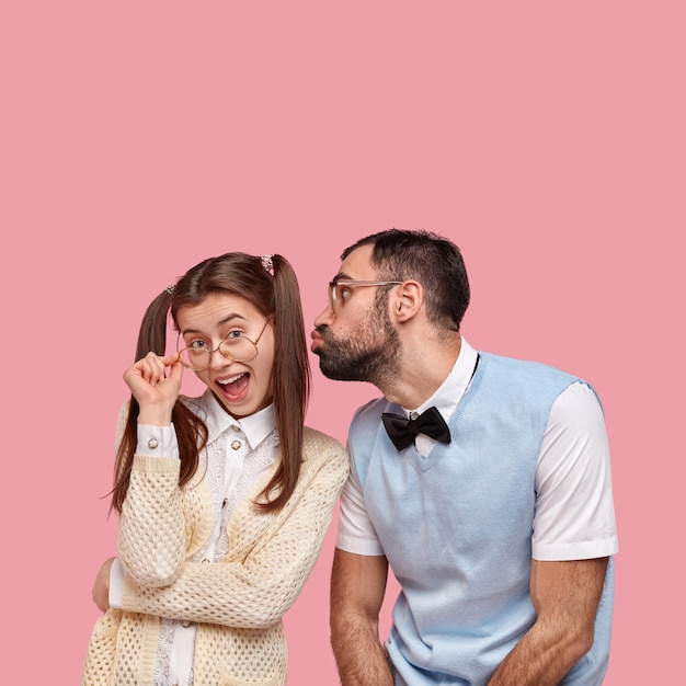 Free photo brunette woman with pigtails and man wearing bowtie and vest