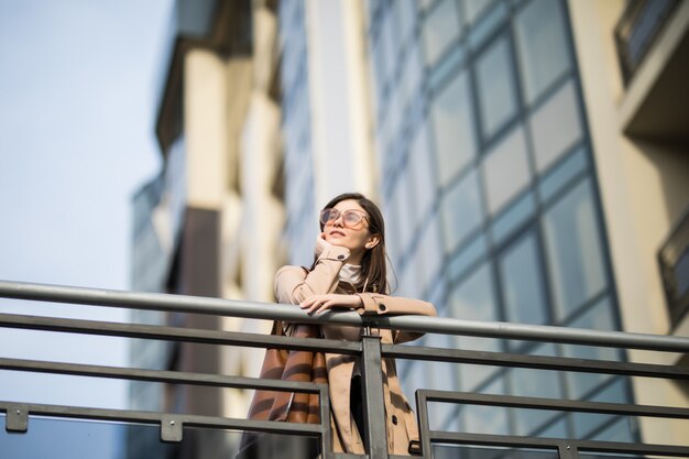 Brunette young woman enjoys of last warm autumn days