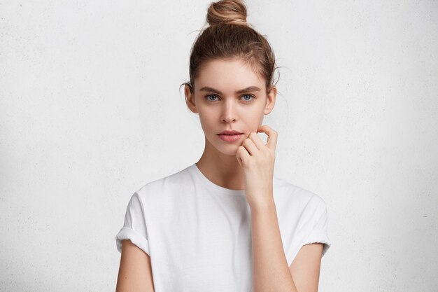 Brunette young woman in white T-shirt