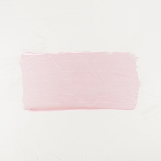 Free photo brush stroke. acrylic paint stain. pink color stroke of the paint brush isolated on white