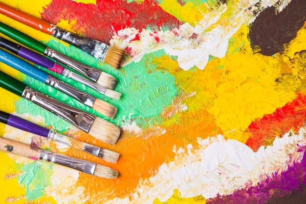 Brushes on colorful painting