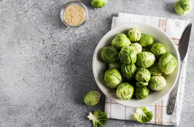 Brussels sprouts cabbage fresh organic in jar on table in kitchen