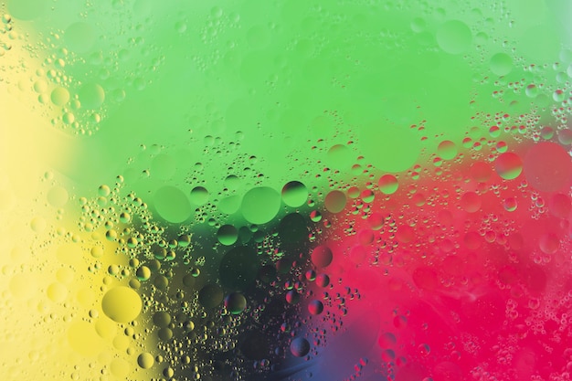 Free photo bubbles over the colorful watercolor background