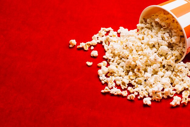 Bucket near spilled popcorn