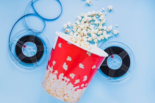 Bucket of popcorn with film reels