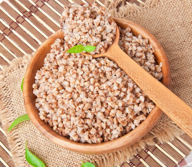 Buckwheat porridge in a wooden bowl