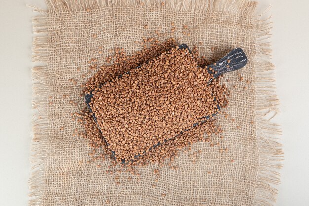 Buckwheat seeds isolated on grey.