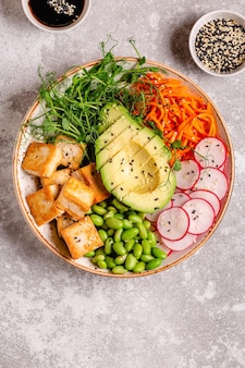 Buddha bowl asian salad with tofu cheese. healthy vegan food, clean eating, dieting.