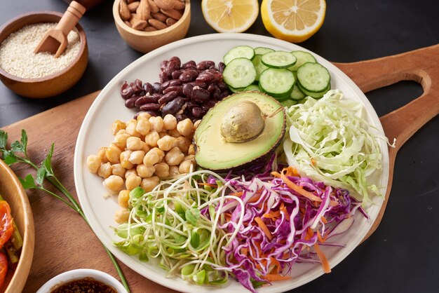 Buddha bowl dish with vegetables and legumes. Top view.