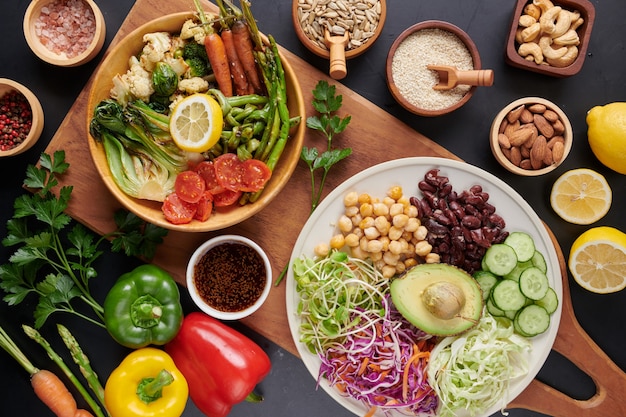 Buddha bowl dish with vegetables and legumes. top view.