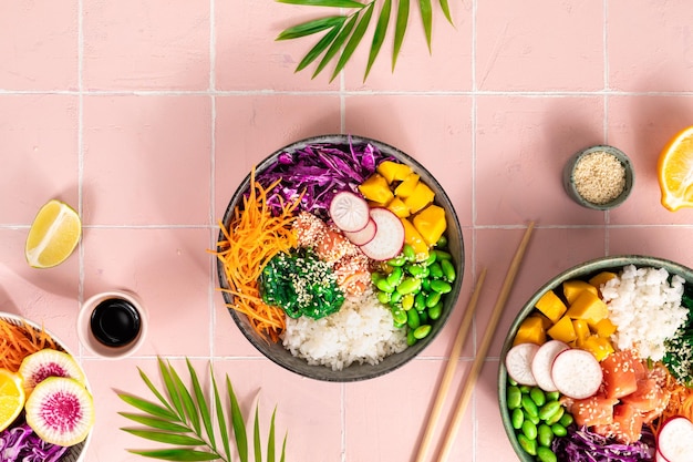 Buddha Bowl Rice with salmon radish red cabbage edamame beans and sesame seeds The concept of delicious and healthy food Space for copying