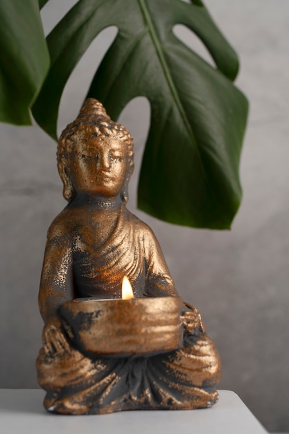 Free photo buddha figurine still life