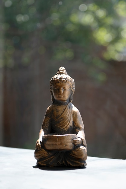 Free photo buddha figurine still life