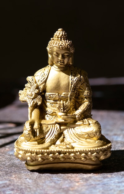 Free photo buddha figurine still life