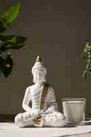 Free photo buddha figurine still life