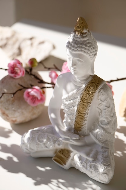 Free photo buddha figurine still life