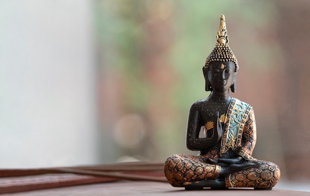 Free photo buddha figurine still life