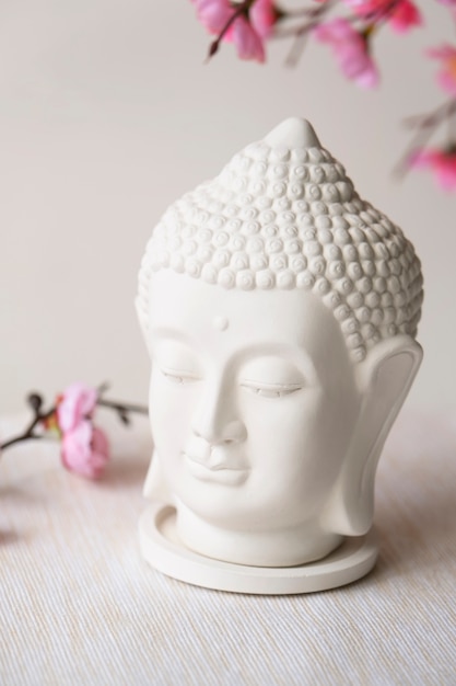 Free photo buddha figurine still life