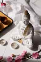 Free photo buddha figurine still life