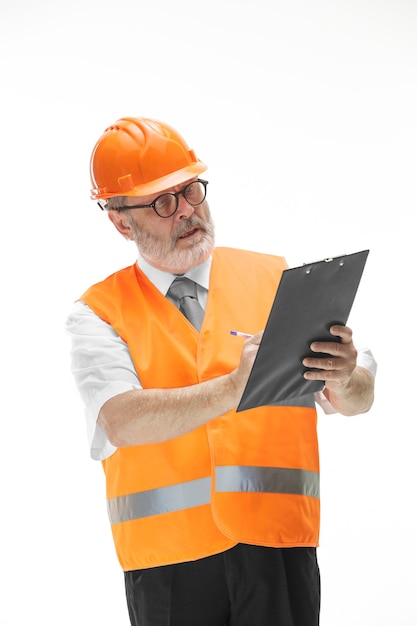 Free photo the builder in orange helmet isolated on white