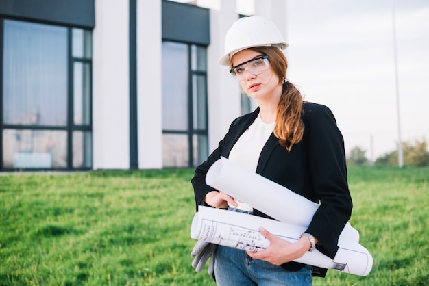 Builder woman with papers